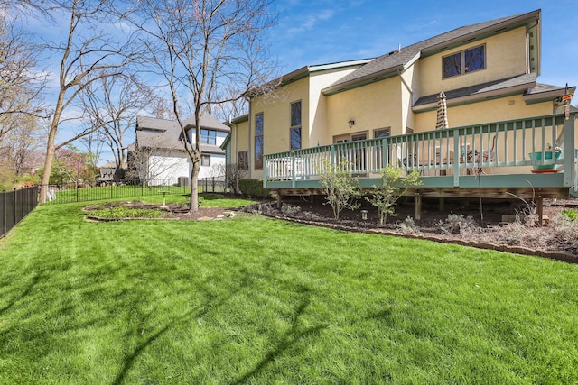 665 Cherrington Rd, Westerville, OH 43081 - back of property featuring a wooden deck, a fenced backyard, a yard, and stucco siding