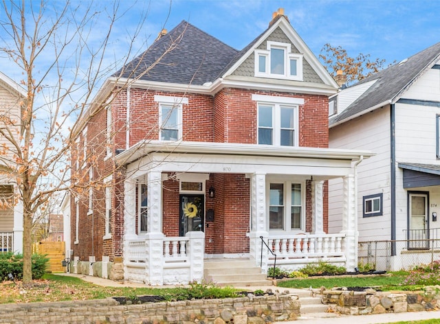 870 Oakwood Ave, Columbus, OH 43206 - view of front of house with brick siding, roof with shingles, and a porch
