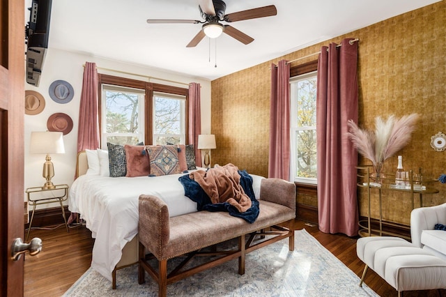 870 Oakwood Ave, Columbus, OH 43206 - bedroom with a ceiling fan, wood finished floors, multiple windows, and wallpapered walls