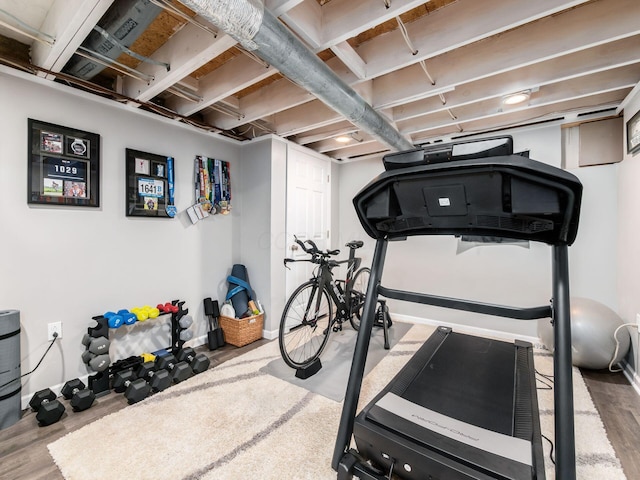 exercise area featuring wood finished floors