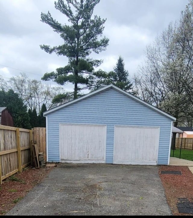 detached garage with fence