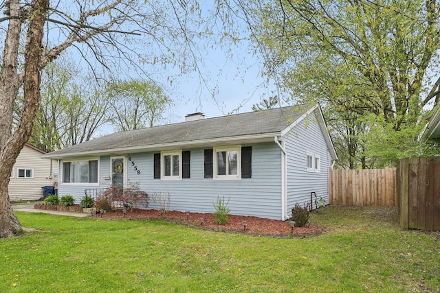 single story home with fence and a front yard