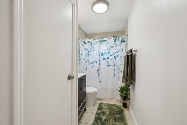 full bathroom with tile patterned floors, vanity, curtained shower, and toilet