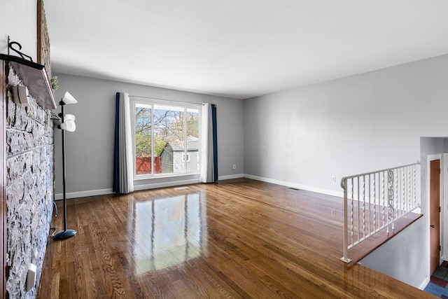 2852 Longfield Rd, Columbus, OH 43204 - unfurnished living room with wood finished floors and baseboards