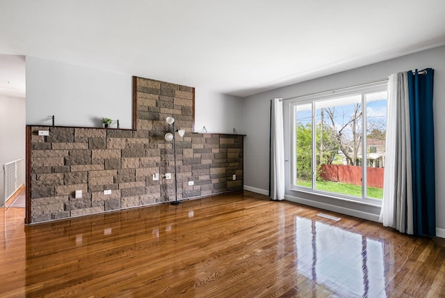 2852 Longfield Rd, Columbus, OH 43204 - unfurnished living room featuring wood finished floors and baseboards