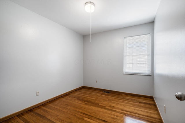 2852 Longfield Rd, Columbus, OH 43204 - spare room with wood finished floors and baseboards