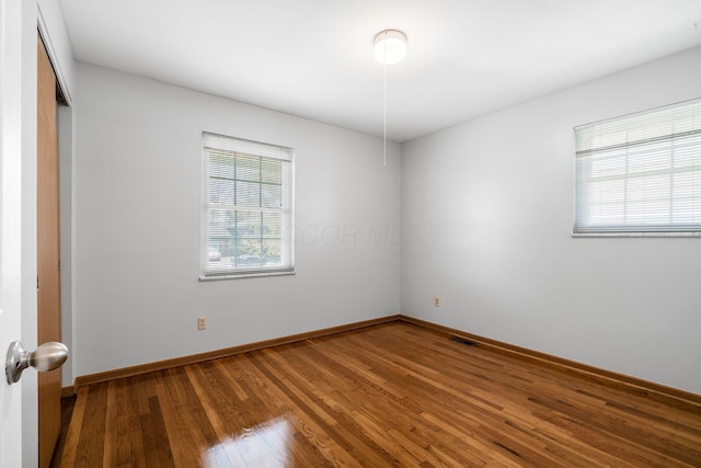2852 Longfield Rd, Columbus, OH 43204 - empty room with wood finished floors and baseboards