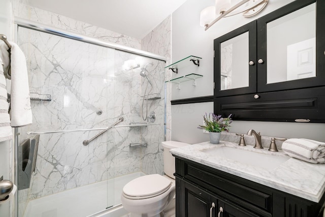 2852 Longfield Rd, Columbus, OH 43204 - bathroom featuring vanity, toilet, and a marble finish shower