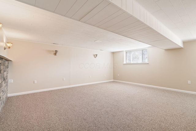 2852 Longfield Rd, Columbus, OH 43204 - basement featuring carpet floors, a fireplace, and baseboards