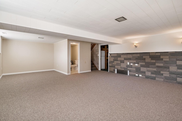 2852 Longfield Rd, Columbus, OH 43204 - finished below grade area featuring carpet floors, stairs, baseboards, and freestanding refrigerator