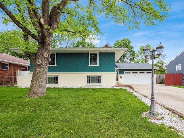 2852 Longfield Rd, Columbus, OH 43204 - view of front facade featuring driveway, an attached garage, and stucco siding