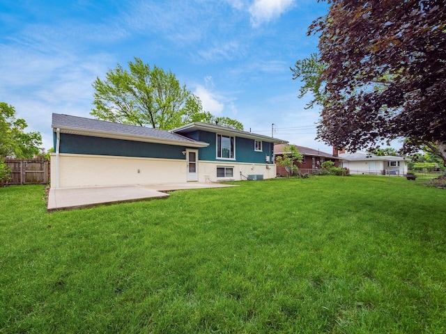 2852 Longfield Rd, Columbus, OH 43204 - rear view of house with a patio area, stucco siding, and central air condition unit