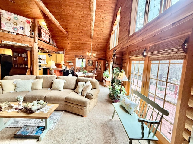 carpeted living area featuring wood ceiling, wood walls, high vaulted ceiling, and a notable chandelier