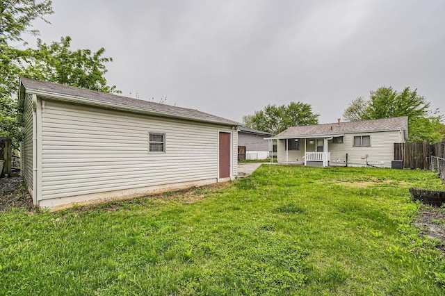 rear view of property with a porch