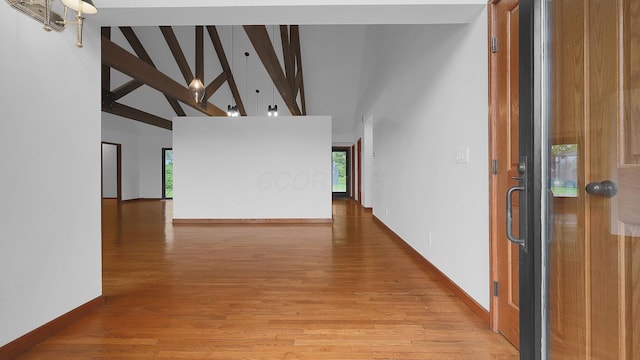 3448 Ostrander Rd, Ostrander, OH 43061 - foyer with high vaulted ceiling, plenty of natural light, beamed ceiling, light wood finished floors, and baseboards