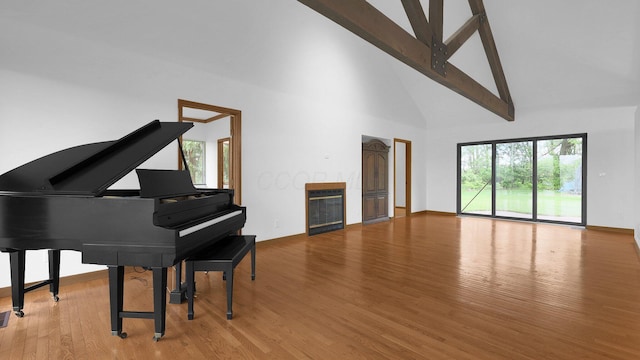 3448 Ostrander Rd, Ostrander, OH 43061 - living area with high vaulted ceiling, wood finished floors, and baseboards