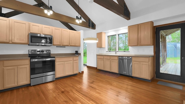 3448 Ostrander Rd, Ostrander, OH 43061 - kitchen with appliances with stainless steel finishes, beamed ceiling, a sink, wood finished floors, and light brown cabinets