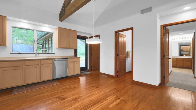 3448 Ostrander Rd, Ostrander, OH 43061 - kitchen with dishwasher, a sink, light wood-type flooring, light countertops, and lofted ceiling