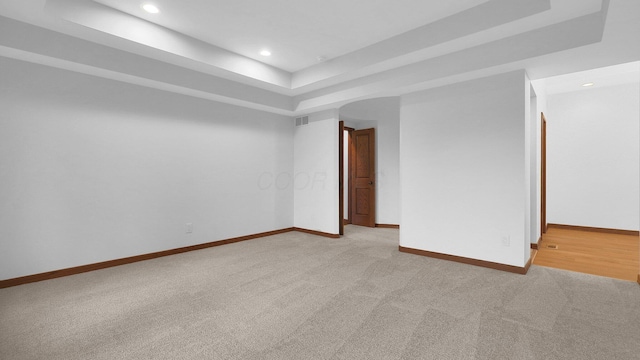 3448 Ostrander Rd, Ostrander, OH 43061 - unfurnished room featuring a tray ceiling, baseboards, light colored carpet, and recessed lighting
