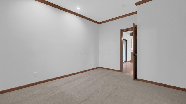 3448 Ostrander Rd, Ostrander, OH 43061 - spare room featuring ornamental molding, light colored carpet, baseboards, and recessed lighting