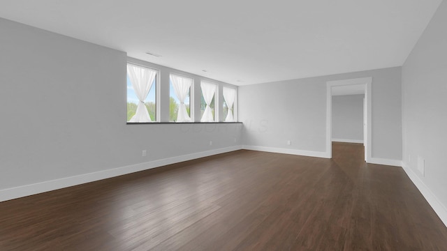 3448 Ostrander Rd, Ostrander, OH 43061 - spare room featuring dark wood-style floors and baseboards