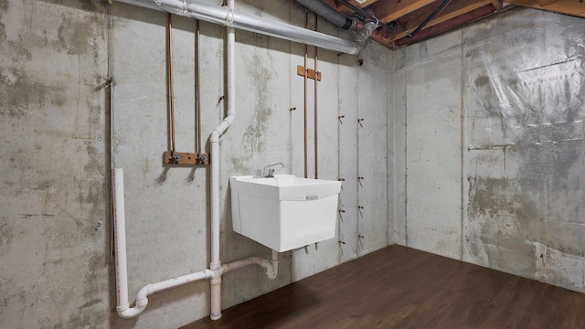 3448 Ostrander Rd, Ostrander, OH 43061 - unfinished below grade area featuring wood finished floors and a sink