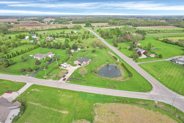 birds eye view of property with a rural view