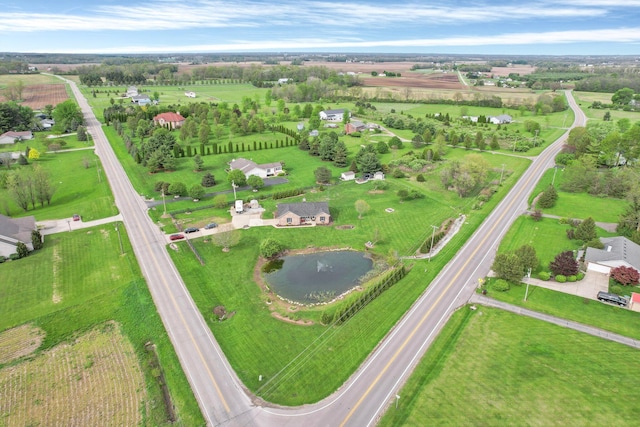 bird's eye view featuring a water view and a rural view