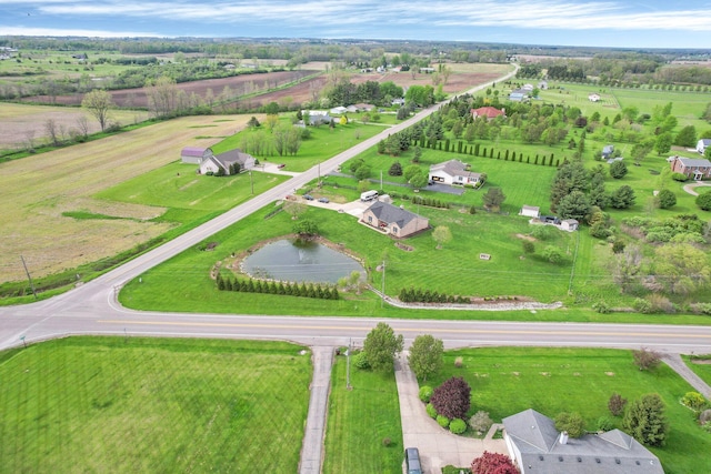 birds eye view of property featuring a rural view