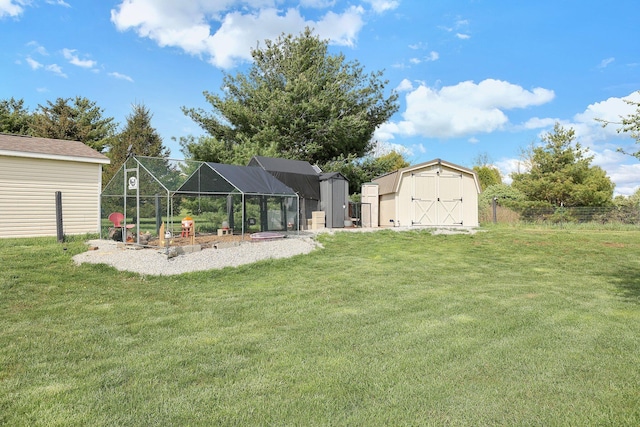 view of yard with a storage shed, exterior structure, and an outbuilding