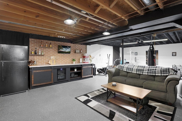 living room featuring speckled floor and bar area
