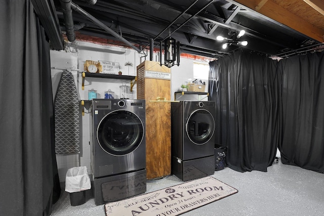 laundry room with separate washer and dryer and laundry area