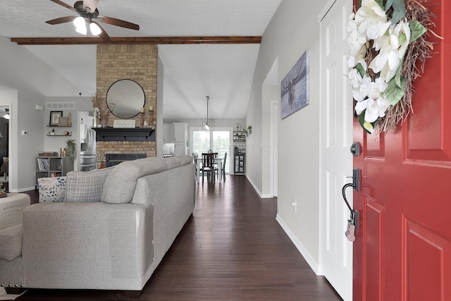 living room with baseboards, a fireplace, a ceiling fan, and dark wood-type flooring