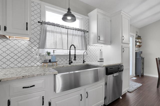 kitchen featuring white cabinetry, decorative backsplash, a sink, and dishwasher