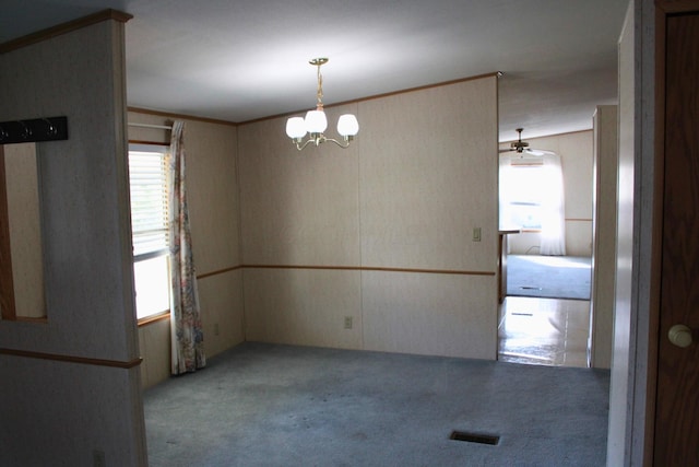 45 Ravine Ridge Dr, Delaware, OH 43015 - spare room featuring a chandelier, visible vents, and carpet floors