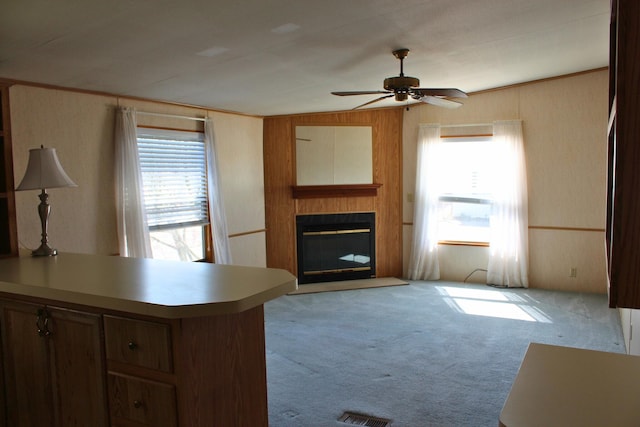 45 Ravine Ridge Dr, Delaware, OH 43015 - living room with plenty of natural light, a fireplace, light colored carpet, and ceiling fan