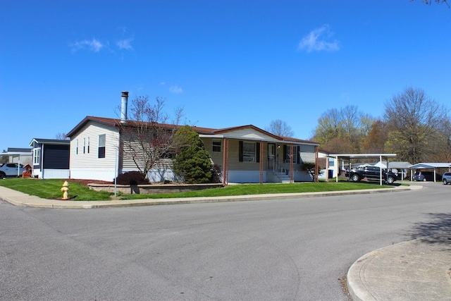 45 Ravine Ridge Dr, Delaware, OH 43015 - manufactured / mobile home with a porch and a front lawn