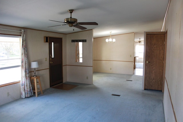 45 Ravine Ridge Dr, Delaware, OH 43015 - spare room featuring a wealth of natural light, carpet flooring, and ceiling fan with notable chandelier