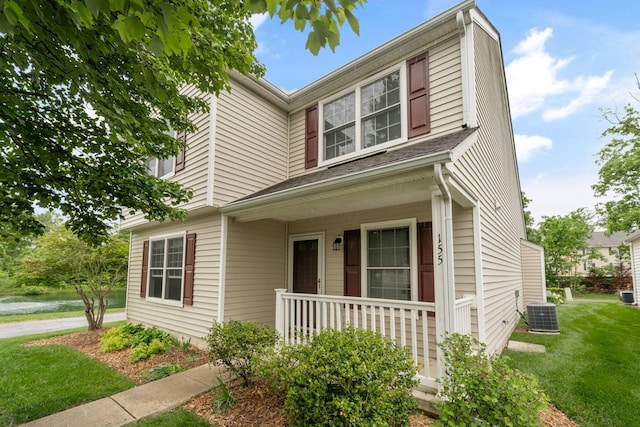 155 Arrowfeather Ln, Lewis Center, OH 43035 - view of front facade with covered porch, a front yard, and central AC unit