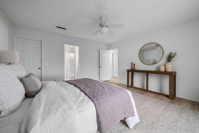 155 Arrowfeather Ln, Lewis Center, OH 43035 - bedroom with light wood-type flooring, baseboards, ensuite bath, and a ceiling fan