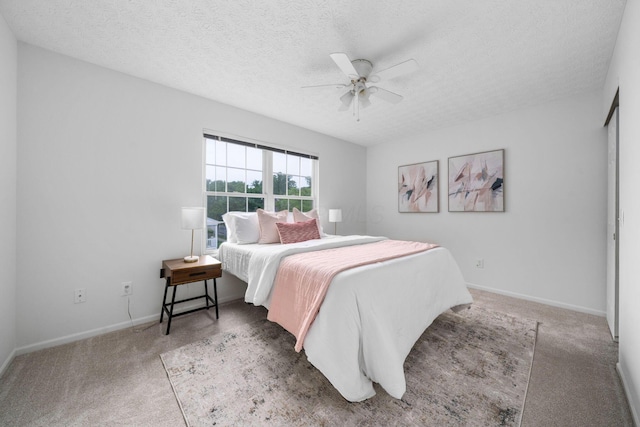 155 Arrowfeather Ln, Lewis Center, OH 43035 - carpeted bedroom featuring a textured ceiling, a ceiling fan, and baseboards