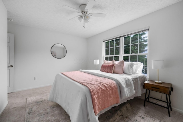 155 Arrowfeather Ln, Lewis Center, OH 43035 - carpeted bedroom featuring a textured ceiling, baseboards, and a ceiling fan