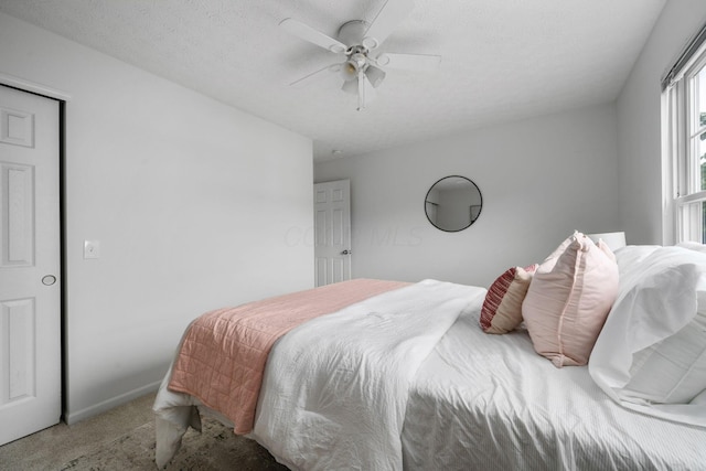 155 Arrowfeather Ln, Lewis Center, OH 43035 - carpeted bedroom with ceiling fan and a textured ceiling