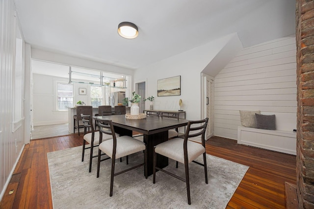 dining space with hardwood / wood-style flooring