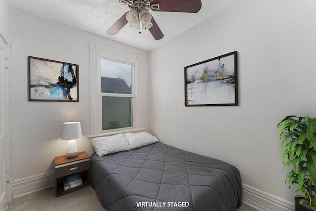 2381/2 E Whittier St, Columbus, OH 43206 - carpeted bedroom featuring a textured ceiling, baseboards, and a ceiling fan