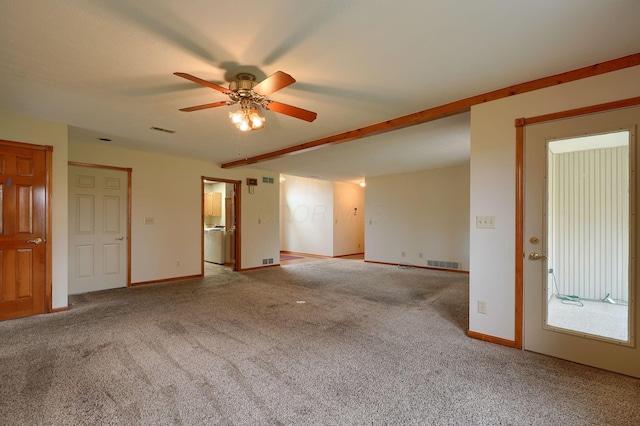 unfurnished room featuring carpet flooring, visible vents, a ceiling fan, and beam ceiling