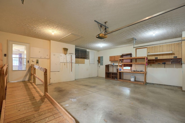 garage featuring a garage door opener and electric panel