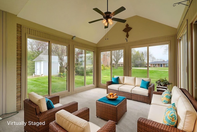 sunroom featuring a ceiling fan and an outdoor hangout area