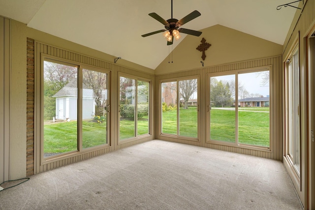 unfurnished sunroom with ceiling fan and a healthy amount of sunlight