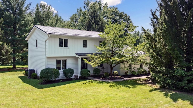 8019 Clouse Rd, New Albany, OH 43054 - traditional-style home with a front lawn, a metal roof, and board and batten siding